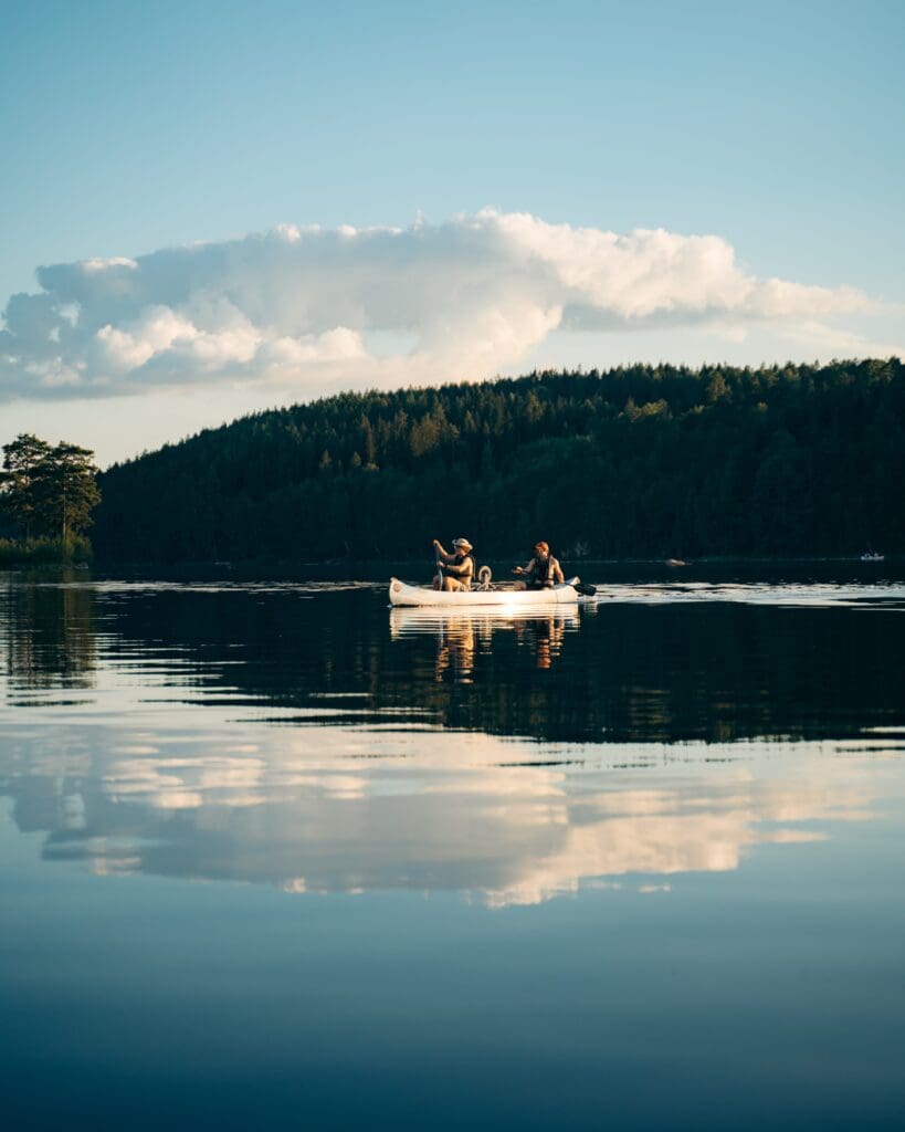 Canoe on the water during sunset in Sweden