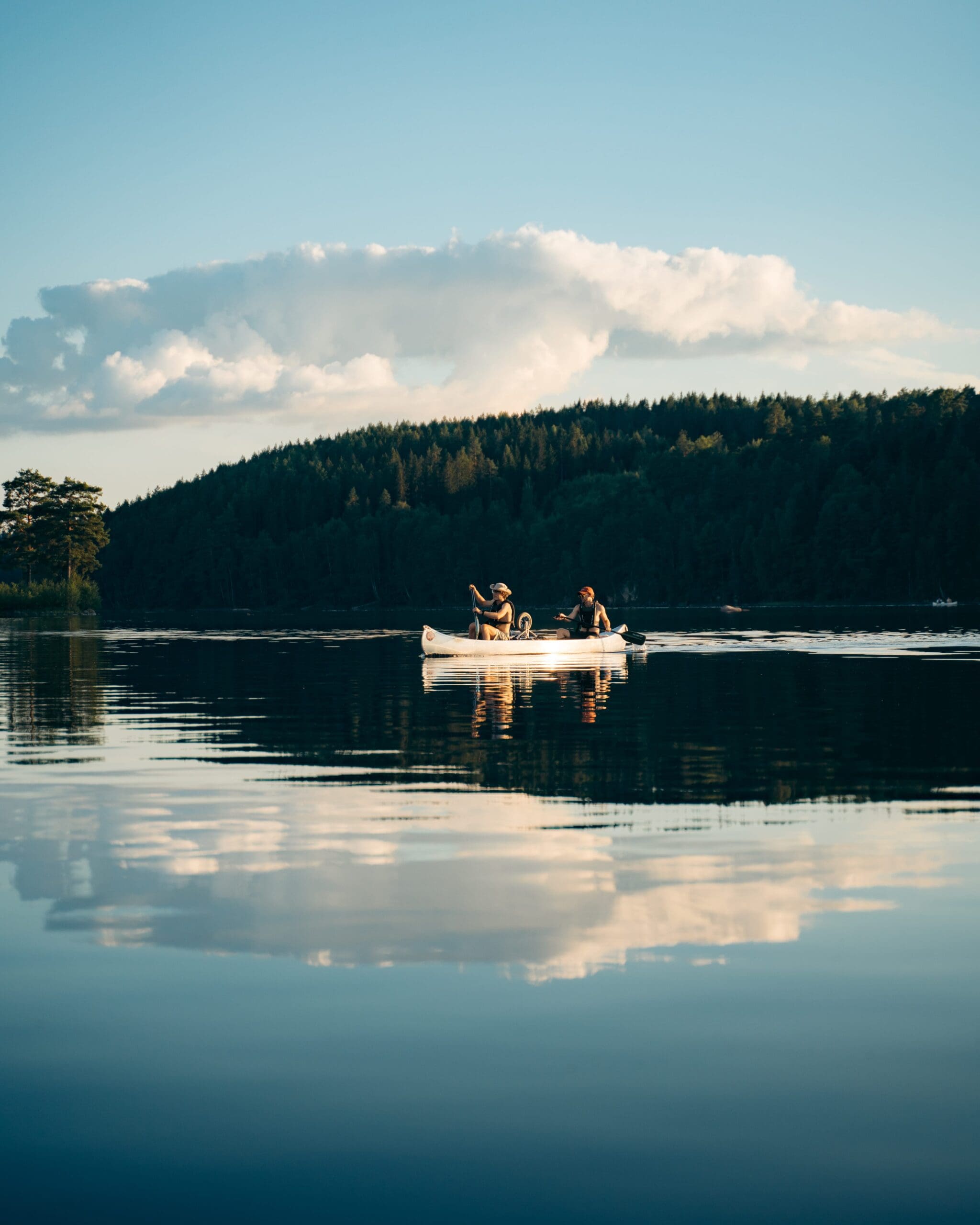 Canoe on the water during sunset in Sweden
