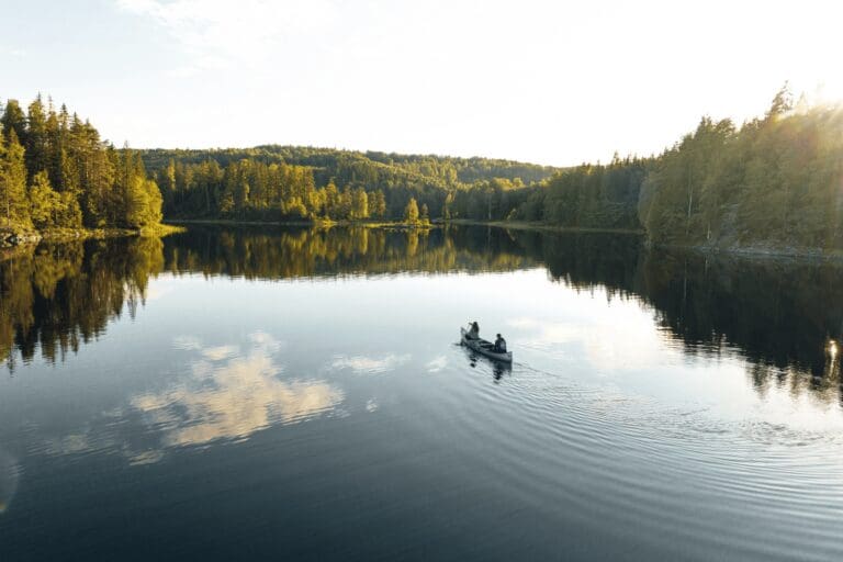 Top 3 outdoor activities to do in Sweden this summer: canoeing, wild camping, and fishing.